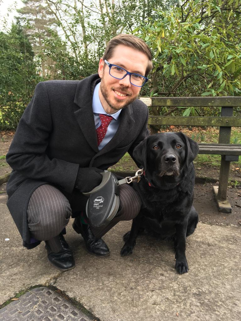 Paul Clark and Pasha the black labrador