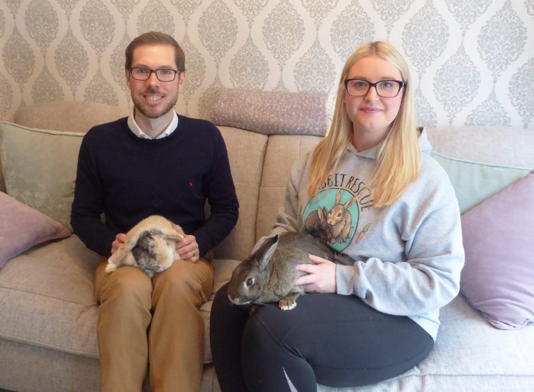 Picture of Paul Clark and Jessica Wood with rabbits Flower and Davey