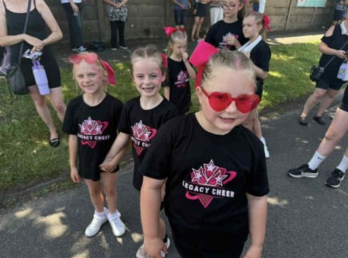 Three members of Legacy Cheer looking cool