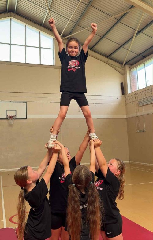 Legacy Cheer performing a pyramid