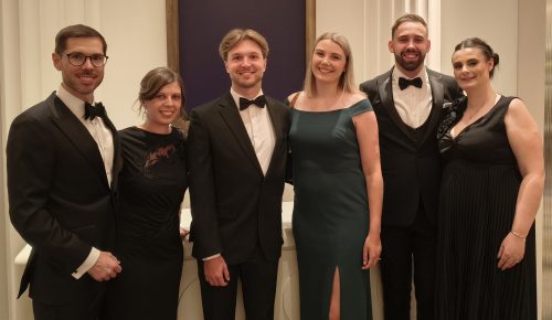 Spall Clark team and their partners in black tie attire