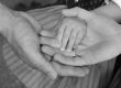Parents in Cheshire holding hands after appointing guardians in will