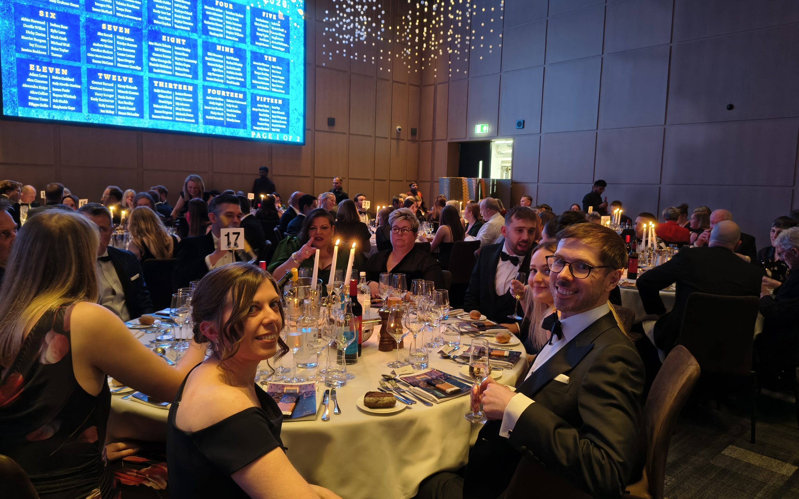 Table at the Probate Industry Awards showing the Spall Clark team. Becky Spall, Paul Clark and Amy Beasley are looking at the camera.